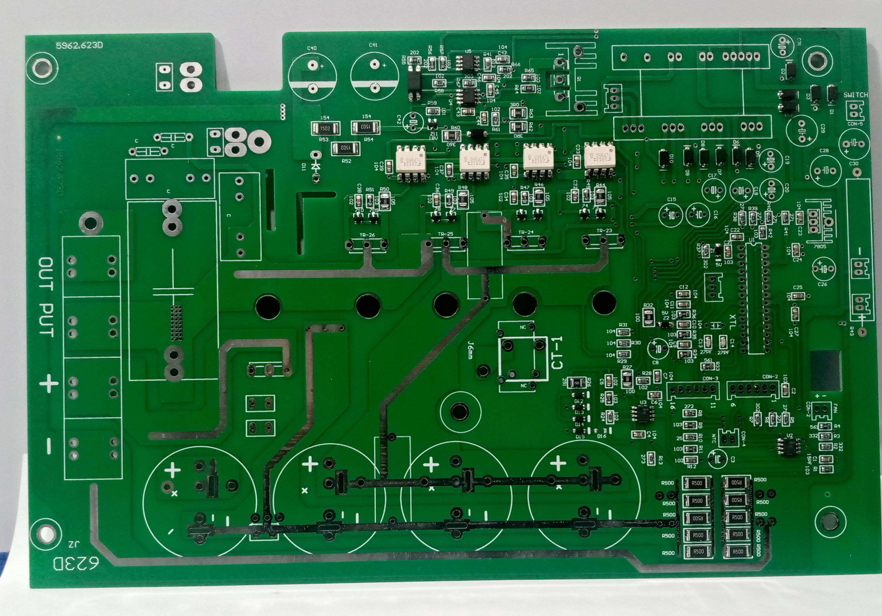 Imported 4 IGBT 5kVA Solar Inverter PCB With Pre Assembled SMD Components For Inverter Manufacturers Not Hobbyists - a green rectangular circuit board featuring pre-assembled SMD components, capacitor slots, and output terminals.