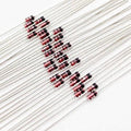 IN4148 1N4148 Diode - a collection of small glass-bodied diodes with red and black markings and long metal leads arranged diagonally on a white background.