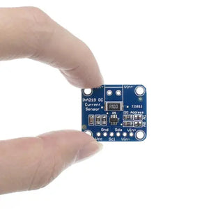 INA219 Bi-direction DC Current Power Supply Sensor Module Gy-219 Module - a blue square circuit board with a shunt resistor, an IC, and labeled pins for Vcc, Scl, and Sda.
