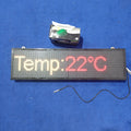 Industrial Clock With Temperature Display RGB Display - a rectangular LED screen displaying "Temp:22°C" with a black sensor probe and tissue box.