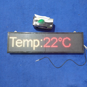 Industrial Clock With Temperature Display RGB Display - a rectangular LED screen displaying "Temp:22°C" with a black sensor probe and tissue box.