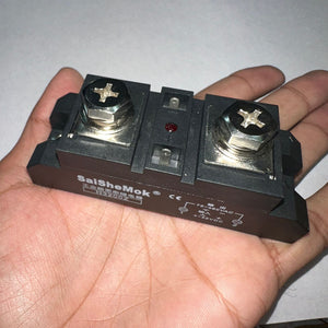 Industrial Solid State Relay DC Control AC Ssr MGR-H3200Z - a black rectangular body with two large screw terminals and an LED.