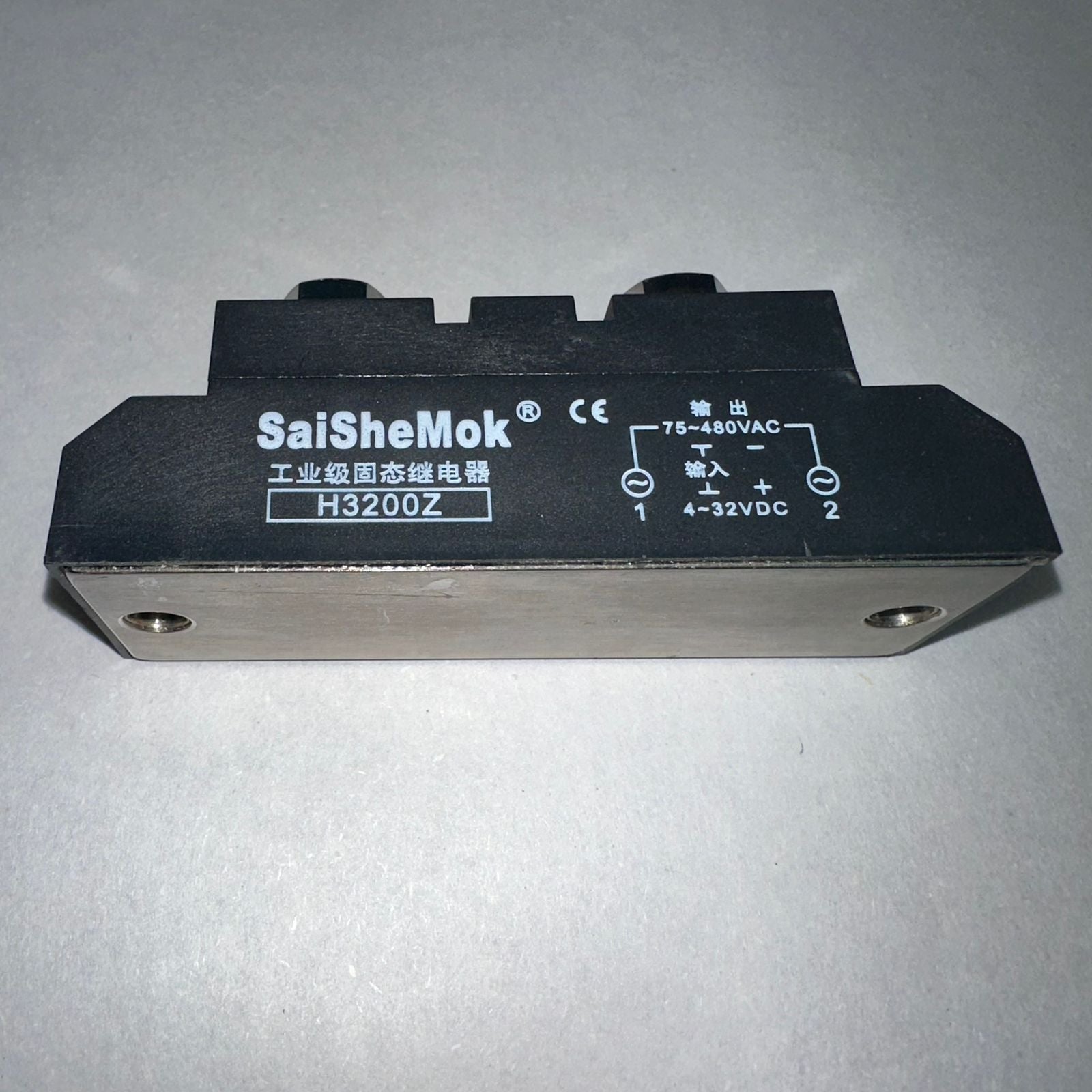 Industrial Solid State Relay DC Control AC Ssr MGR-H3200Z - shown as a black rectangular module with a metal base and printed technical specifications.