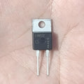 Infineon E08ED2 650V 8A Rapid Switching Diode (TO-220-2) - a black TO-220-2 electronic component with two metal pins, held against a person's palm.