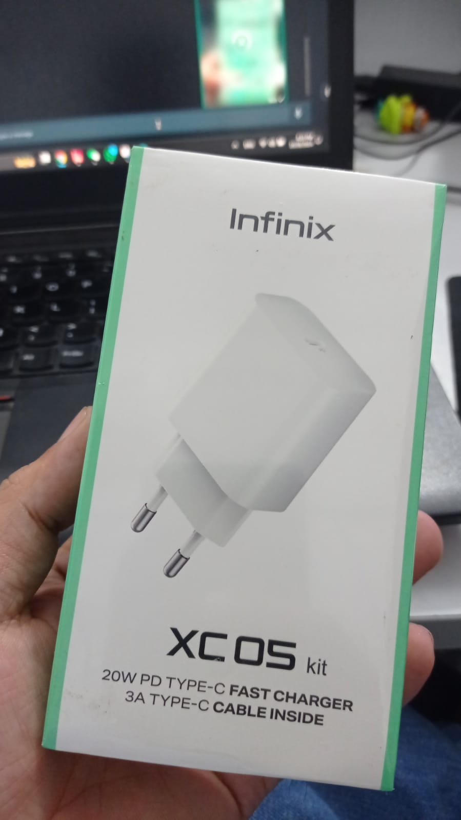 Infinix XC05 Kit 20W Wall Charger + Type-c To Type-c Cable | Digilog.pk - the white retail box with a graphic of the wall charger and text listing the kit contents.