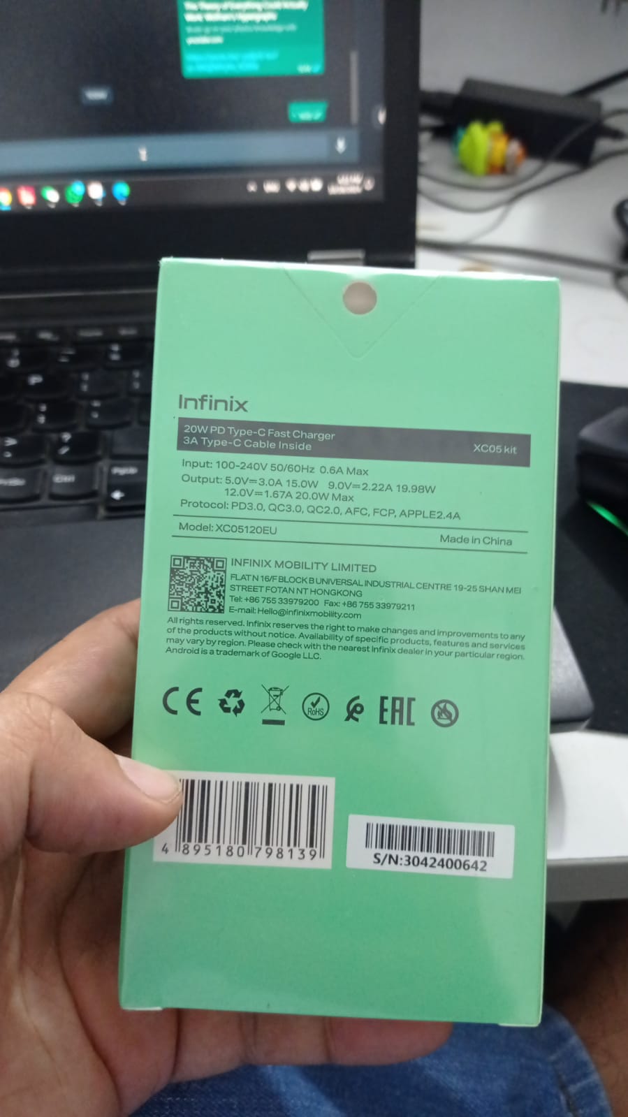 Infinix XC05 Kit 20W Wall Charger + Type-c To Type-c Cable | Digilog.pk - a light green rectangular box showing technical specifications, model number, and a barcode on the back.