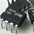IR2103 Half-bridge Driver - a close-up showing two black 8-pin integrated circuit chips with the text IR2103 and 0343 printed on the top surface.