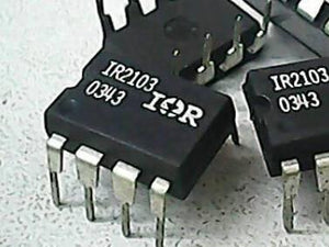 IR2103 Half-bridge Driver - a close-up showing two black 8-pin integrated circuit chips with the text IR2103 and 0343 printed on the top surface.