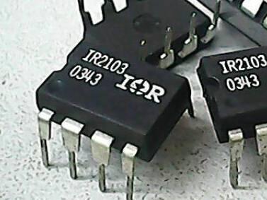 IR2103 Half-bridge Driver - a close-up showing two black 8-pin integrated circuit chips with the text IR2103 and 0343 printed on the top surface.