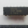 IR2110 MOSFET And IGBT Driver IC | Digilog.pk - a black rectangular 14-pin integrated circuit chip with white text markings, shown against a ruler for scale.