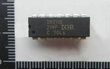 IR2110 MOSFET And IGBT Driver IC | Digilog.pk - a black rectangular 14-pin integrated circuit chip with white text markings, shown against a ruler for scale.