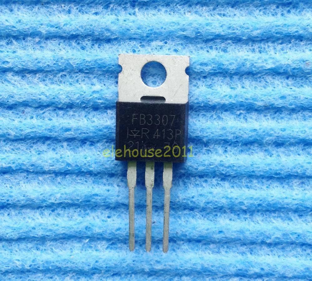 IRFB3307 Mosfetin Pakistan - black electronic component with a metal heat sink tab and three downward-facing pins, resting on a blue textured surface.