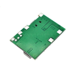 J5019 Hw 357: Versatile Li-ion Charger And Boost Module For a Wide Range Of Applications - green rectangular printed circuit board shown from the back side, featuring several solder pads and through-hole connection points.