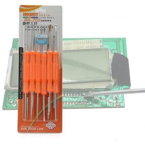 Jakemy 6 In 1 Soldering Repairing Assist Tools Set Kit Toolkit JM-Z01 - shown placed over a green circuit board with an LCD screen.