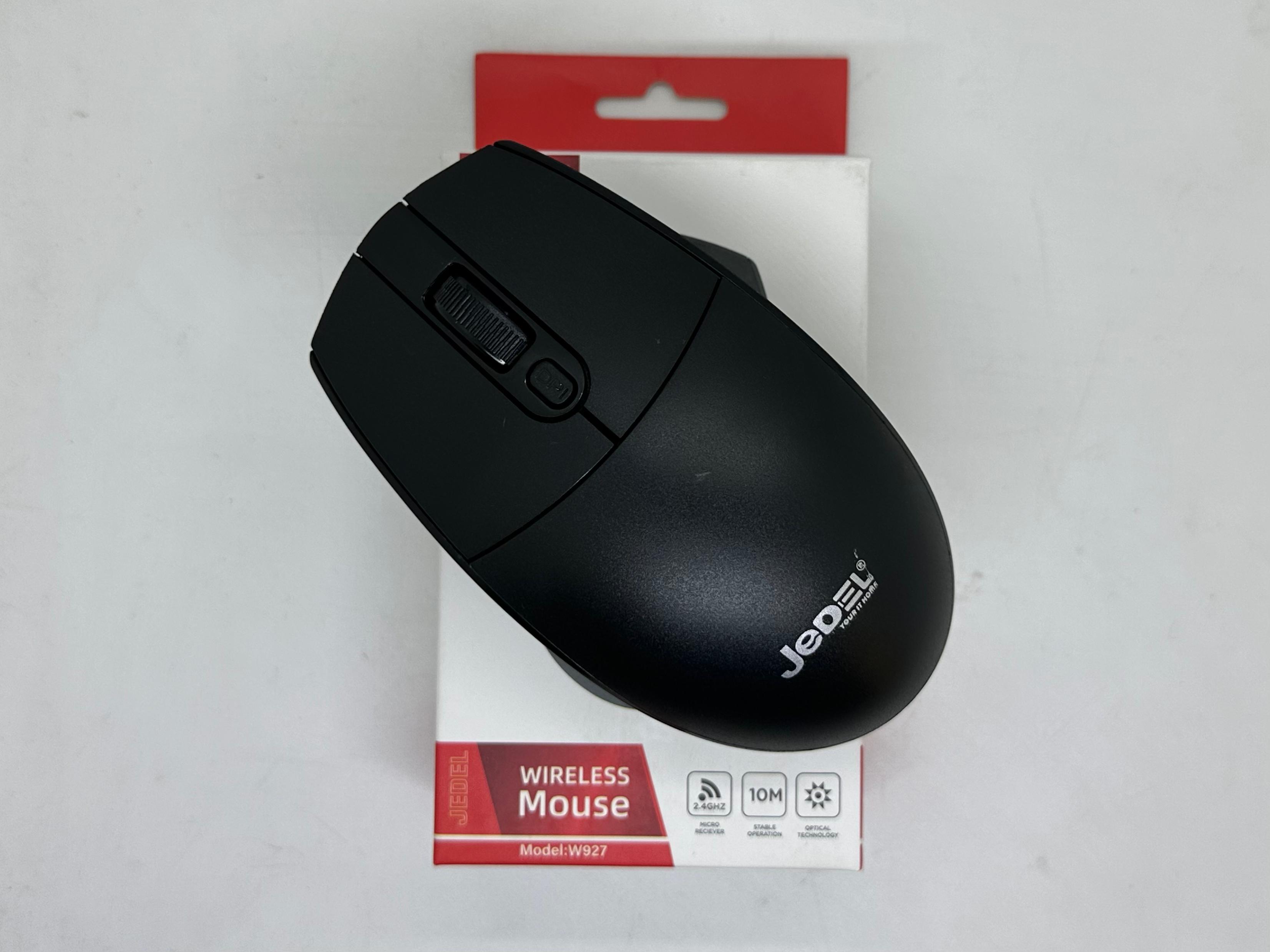 Jedel W927 2.4GHz Wireless Mouse – Optical, Nano Receiver, 10M Range - a black wireless mouse with a scroll wheel resting on its retail packaging box.