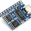 JQ8400-FL Voice Serial Port Control USB Copy Synthesis Music Chip Voice IC Module - a blue rectangular circuit board featuring a micro-USB port, multiple integrated chips, and a row of gold-plated header pins.