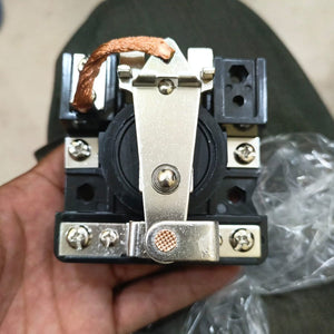 Jqx 65F 12V Relay - a black electrical component with a silver metal contact arm, a copper braided wire, and screw terminals, held in a hand.
