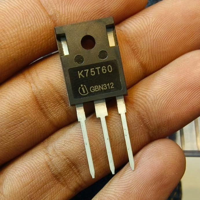 K75T60 IGBT IKW75N60T 600V 75A IGBT - a black three-pin electronic component held in a hand with the text K75T60 and GBN312 printed on the front.