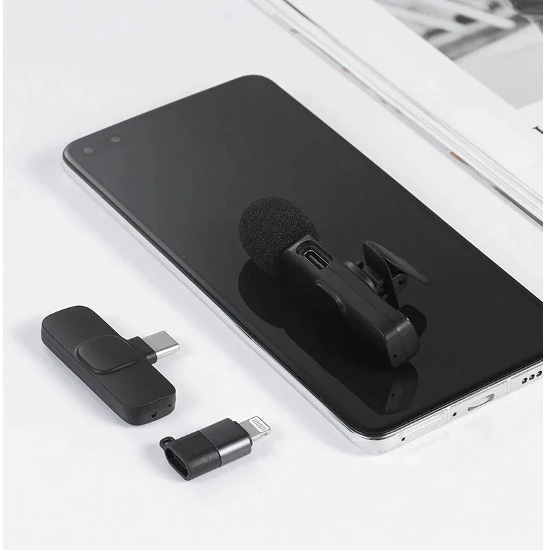 K9 Wireless Microphone For Mobile Type-c & Lightning - a black clip-on microphone, a Type-C receiver, and a Lightning adapter on a white surface.