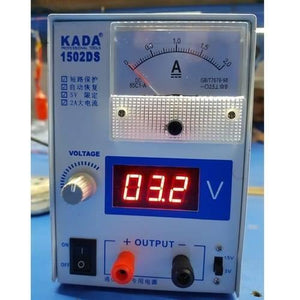 Kada 1502DS Adjustable Digital Power Supply 12V 2A DC Regulator Supply For Mobile Repairing - an analog ammeter, a digital display reading 03.2 V, a voltage knob, power switch, and output terminals.