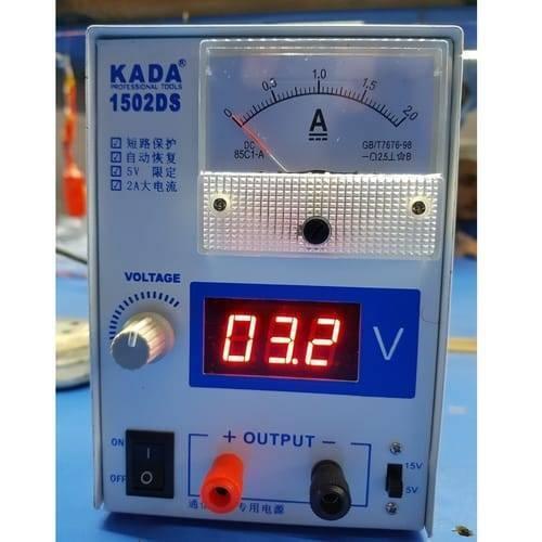 Kada 1502DS Adjustable Digital Power Supply 12V 2A DC Regulator Supply For Mobile Repairing - an analog ammeter, a digital display reading 03.2 V, a voltage knob, power switch, and output terminals.