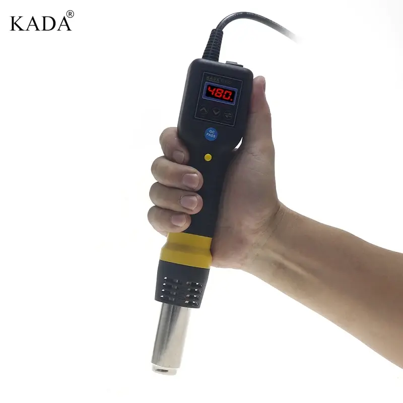 Kada 835D Hot Air Gun SMD Rework Station Thermo Control Anti Static Portable SMD Rework Station - held in a hand, featuring a black and yellow body, a digital display showing 480, control buttons, and a metal nozzle.