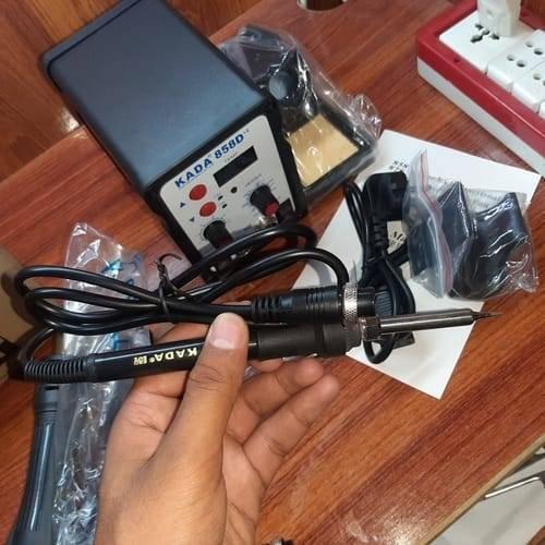 KADA858D+2 Kada 858D+2 Digital SMD Soldering Rework Station With Hot Air Gun And Soldering Iron - the main unit with a digital display, knobs, buttons, a handheld soldering iron, and various included accessories.