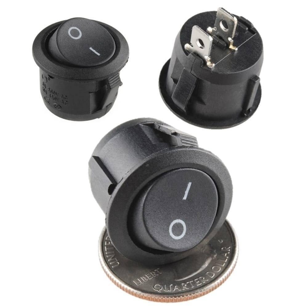 Kcd-107 Spst Round Rocker Switch Button - shown as three black circular switches with two metal terminals, one resting on a US quarter dollar coin.