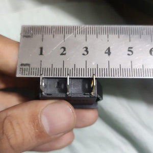 KCD3-104N Red Light 3pin Spst On And Off Rocker Switch - shown in a close-up view with a metal ruler measuring the distance between its three metal terminals.