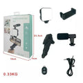 Kd-49/20 Vlog Kit Vlogging Kit Video Making Kit With Microphone - a box with dimensions and its contents: a light, phone holder, microphone, tripod, remote, and cable on a white background.