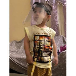Kids Protective Face Sheild Professional Grade Face Mask - Shield Professional Grade Face Mask worn by a young child, featuring a clear plastic visor with a black adjustable headband.