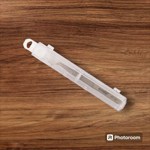 Koocu St-30 Non-magnetic Stainless Steel Precision Chip Placement Tweezer - tweezers inside a clear plastic storage case, positioned diagonally on a wood-grain surface.