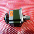 KT60KM06-011 0.6 Degree Step Angle Star Winding 3 Phase Stepper Motor - a silver and dark green square motor with a metal shaft, a knurled knob, and a circular mounting plate.