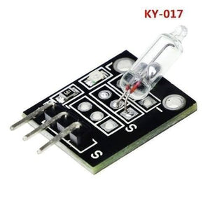 Ky 017 Mercury Medallion Module - a black circuit board featuring a glass mercury switch, a small LED, a resistor, and three metal connector pins.