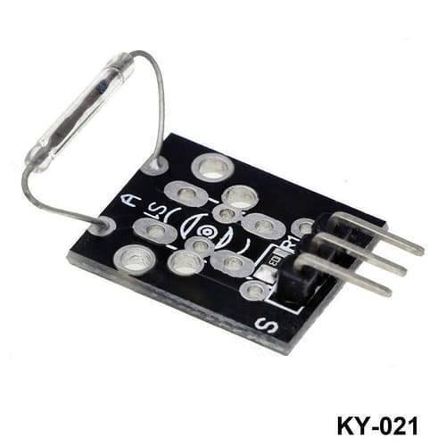 Ky 021 Mini Magnetic Reed Sensor Module 3-pin For Arduino Smart Car - a black rectangular circuit board with a glass reed switch and a three-pin connector.