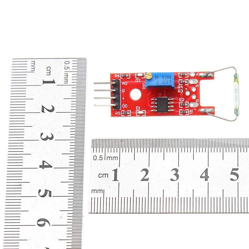Ky-025 Reed Switch Sensor - shown on a red circuit board with a reed switch, four pins, a potentiometer, and two metal rulers for scale.