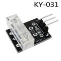 Ky-031 Ky 031 Knock Sensor Module Tap Sensor - a black PCB with a clear plastic knock sensor, a surface-mount resistor, and a three-pin male header connector.
