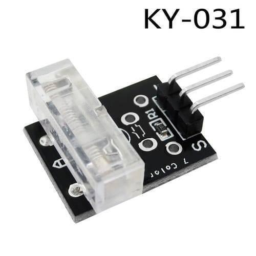Ky-031 Ky 031 Knock Sensor Module Tap Sensor - a black PCB with a clear plastic knock sensor, a surface-mount resistor, and a three-pin male header connector.