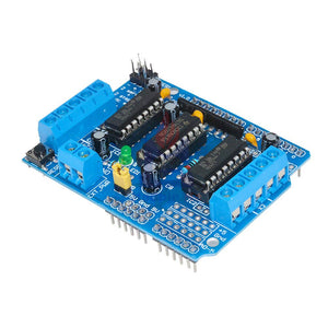 L293 L293D Motor Driver Module Arduino Motor Driver Shield - a blue rectangular circuit board featuring two integrated circuits, screw terminals, header pins, and a reset button.