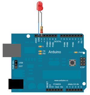 Large 10mm Red LED - connected to an Arduino board via a resistor and jumper wires, showing the LED inserted into the digital pin 12 and GND ports.