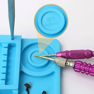 Large Heat Insulation Silicone Soldering & Repairing Mat - a blue silicone mat with a magnetic circular area, shown with tweezers and two metal screwdrivers.