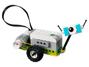 Lego Wedo 2.0 Educational Kit - a small robot built from white, grey, green, and blue bricks with a black tire, a yellow belt, and a single eye.