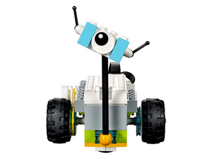 Lego Wedo 2.0 Educational Kit - a small robot built from white, grey, light blue, and yellow bricks with black wheels and a single eye piece.