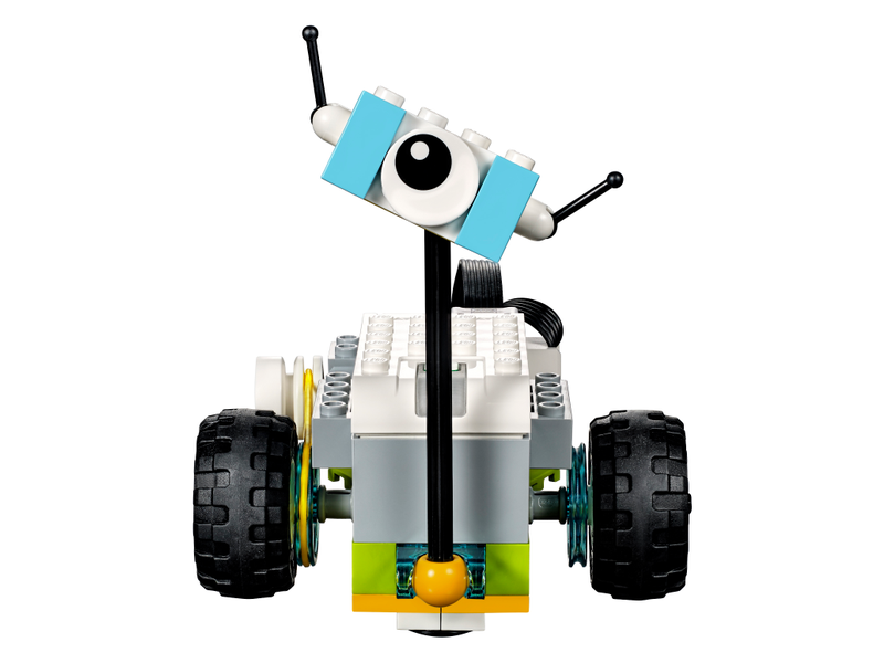 Lego Wedo 2.0 Educational Kit - a small robot built from white, grey, light blue, and yellow bricks with black wheels and a single eye piece.