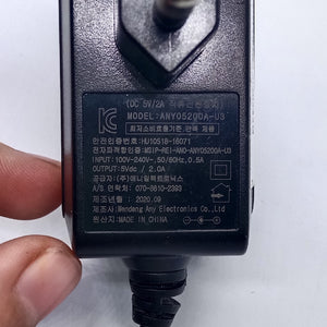 LG U+ 5V 2amp Power Adaptor Kecil Jack - a black wall-plug power adapter showing its technical specifications and regulatory markings printed on the label.