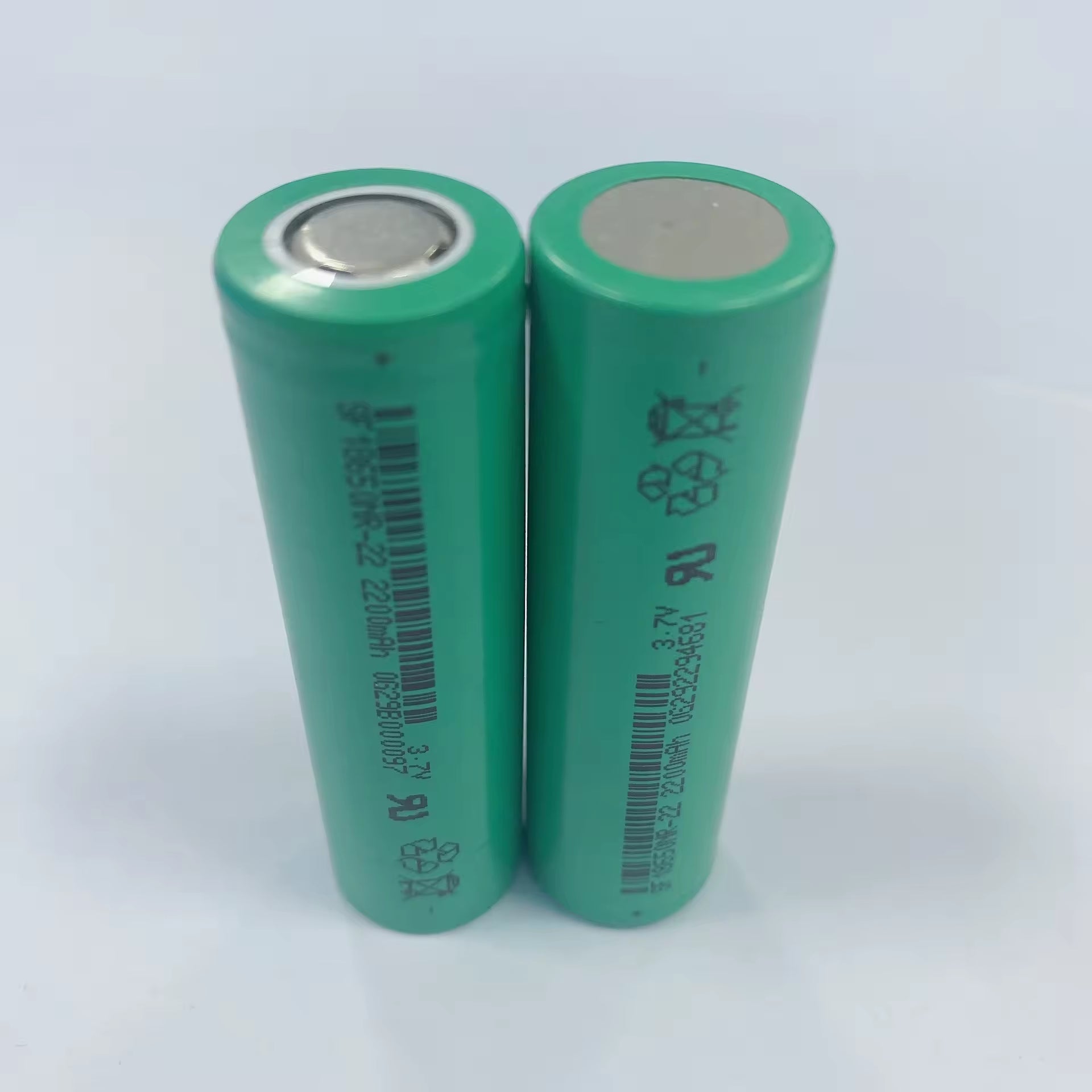 Li-ion 18650 2200mAh Rechargeable Battery Cell (SF 18650NR-22) - two green cylindrical batteries standing upright showing printed text and barcodes.