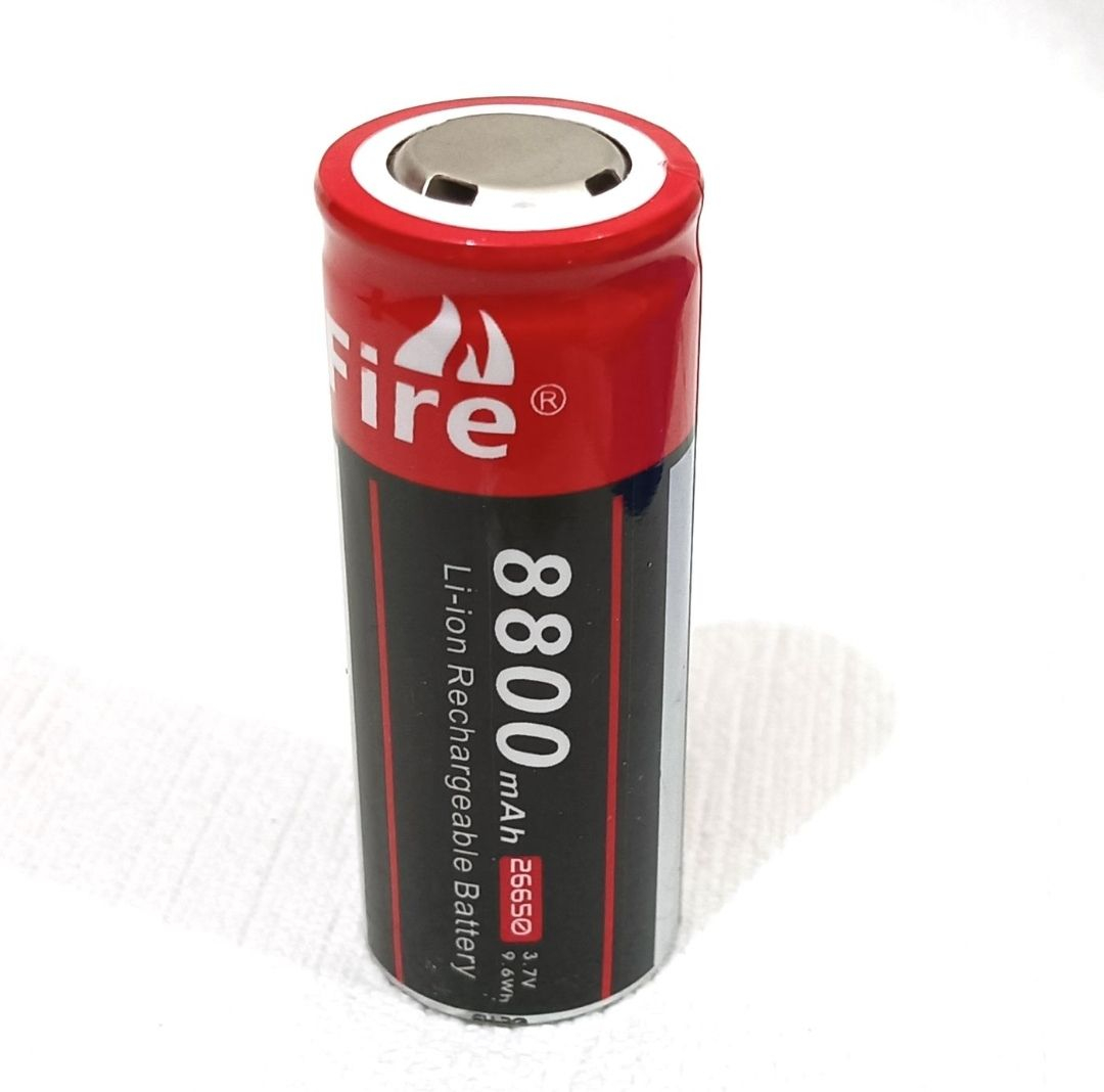 Li-ion Rechargeable Battery Cell 3.7V 3000mAh| High Capacity 26650 - a cylindrical red and black battery labeled 8800mAh 26650 3.7V 9.6Wh standing on a white surface.