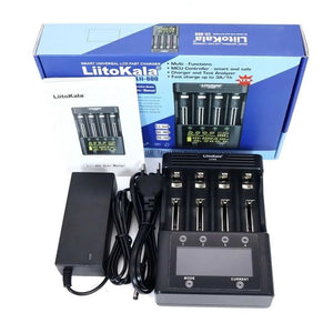 Liitokala Lii-600 Smart battery Charger and Tester With Power Supply - shown with its black box, user manual, power adapter, and the four-slot charging unit with LCD screen.