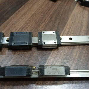 Linear Bearing Slide Rail CNC Router - two silver metal rails with black and silver sliding blocks, one labeled IKO LWL15BCS.