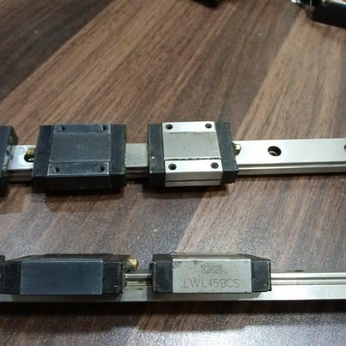 Linear Bearing Slide Rail CNC Router - two silver metal rails with black and silver sliding blocks, one labeled IKO LWL15BCS.